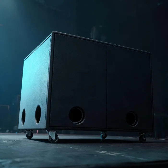 QSC subwoofer cabinet on a venue floor